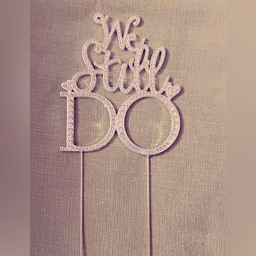 “We still do” anniversary cake topper.
